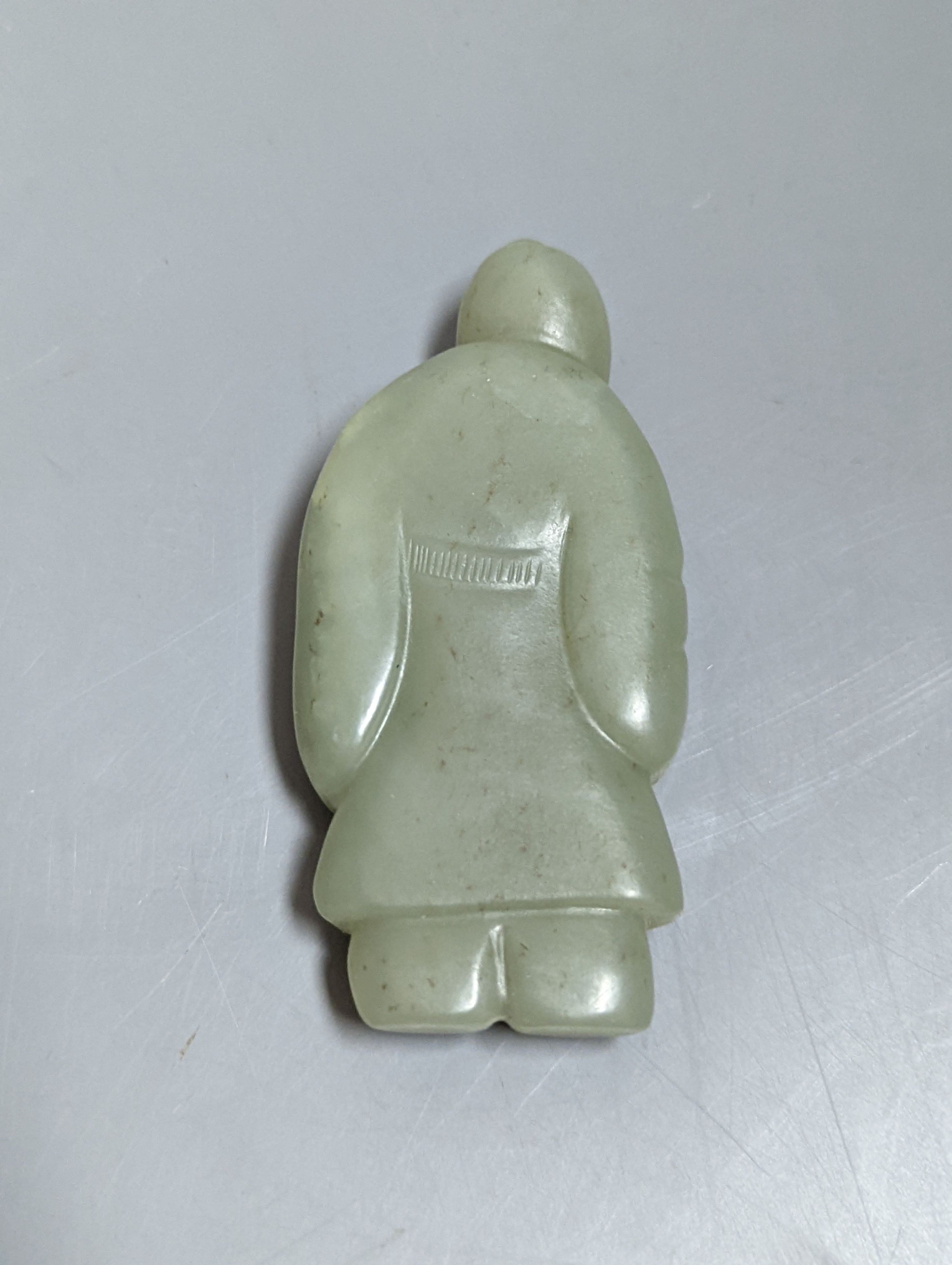 An early 20th century Chinese carved ivory figure of Shao Lao on stand and a jade figural carving 13cm